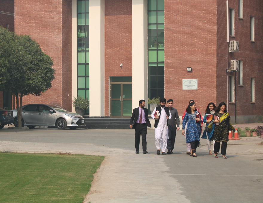 Participants walking together across the IRSA campus